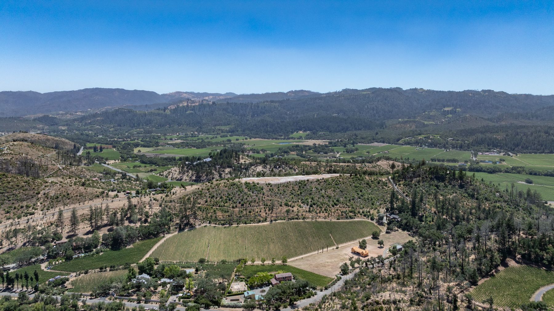 Wide view of Napa Valley from Silverado Trail, with the plateau at 3560 Silverado Trail North visible in the landscape