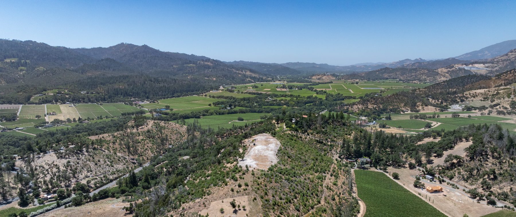 Panoramic view of the graded plateau at 3560 Silverado Trail North, looking out over the valley